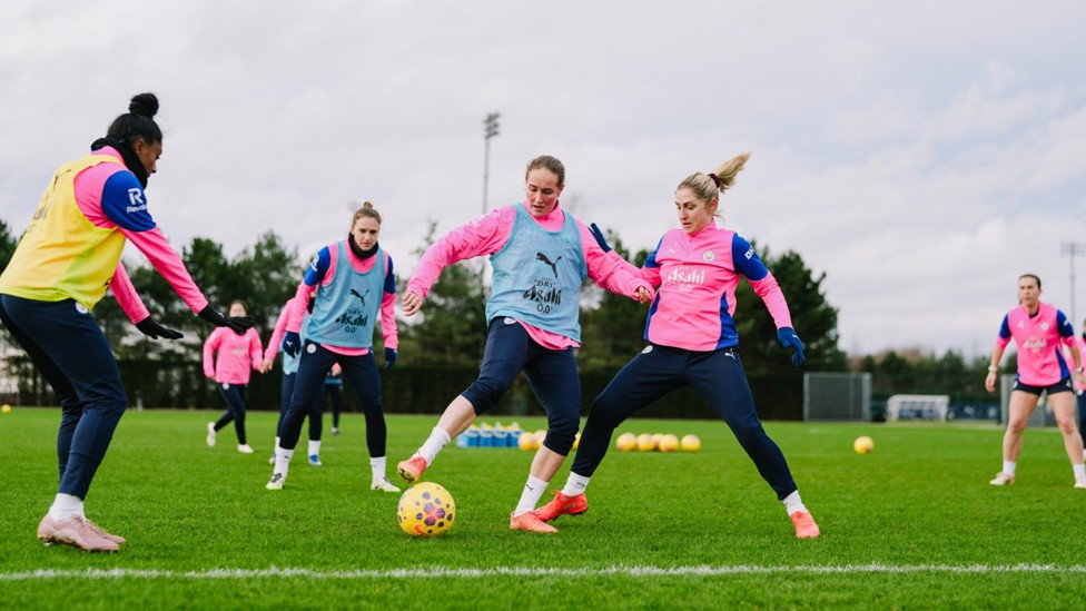 HEAT OF BATTLE : Sydney Lohmann and Laura Coombs compete for possession