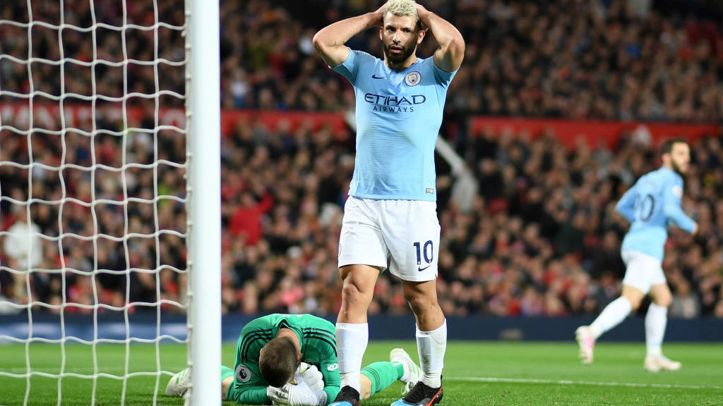 CLOSE CALL: Sergio Aguero can't hide his frustration after Raheem Sterling's goal-bound shot is saved by David De Gea