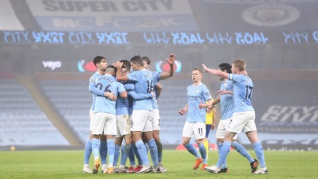 GROUP HUG: The players share the love after Foden's opener.