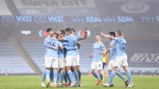 GROUP HUG: The players share the love after Foden's opener.