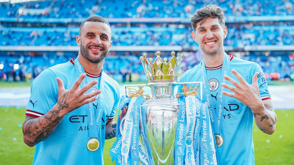 FANTASTIC FIVE  : Walker and Stones celebrate their fifth Premier League title together in 2022/23.