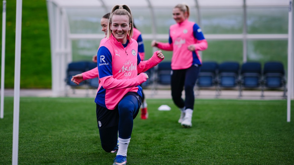 PREPARATION IS KEY : Lauren Hemp leads some dynamic stretches.