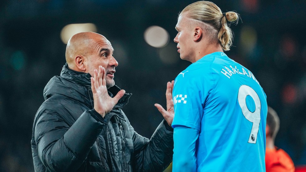 WELCOME BACK: Pep hands out instructions to Erling Haaland as he prepares to return. 