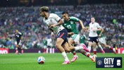 Players from England and Mexico competing for the ball during a soccer match at the World Cup. The event is sponsored by Manchester City and FIFA.