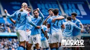Manchester City players in light blue jerseys celebrate during a match at the Etihad Stadium. Faces are blurred, and the text 'Monday Marker' appears in the bottom right corner.