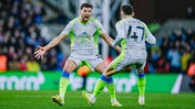Two Manchester City players celebrating a goal during a match, one identified as Phil Foden with jersey number 47.