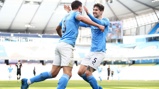 BROMANCE: Stones is the first to congratulate his defensive partner Dias after his goal.