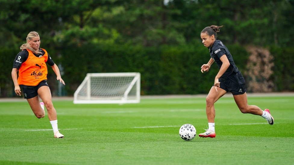 ORANGE ALERT : Iman Beney comes under pressure from Poppy Pritchard