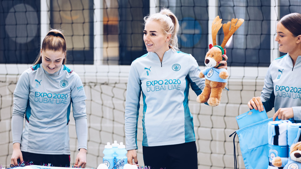 SANTA'S HELPERS : Jess Park, Alex Greenwood and Ruby Mace on wrapping duty!
