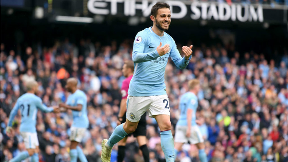 ALL SMILES... and he can't contain his delight after opening his account at the Etihad
