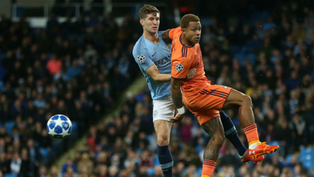 TIME TO RESPOND: John Stones in action against Lyon's Memphis Depay