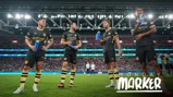 Four Manchester City football players in black and gold kits are holding blue water bottles on a football field, with stadium lights and crowd in the background. Text reads 'Monday Marker'.