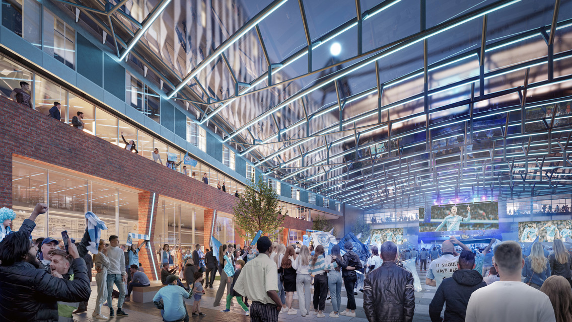 A fan zone with people gathering under a glass roof, with Manchester City flags and a large video screen displaying sports events.