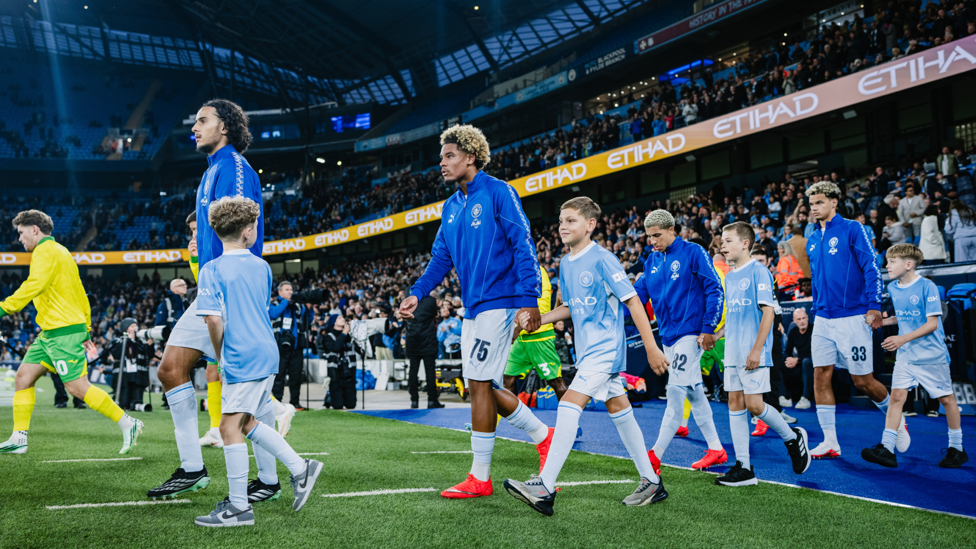 FIRST FOOTING: Debutant Floyd Samba strides out with his City colleagues ahead of kick-off.