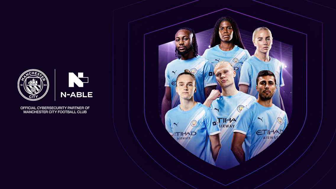 Manchester City players in home kit with N-able logo. Partnership announcement as official cybersecurity partner. Man City and N-able logos visible.