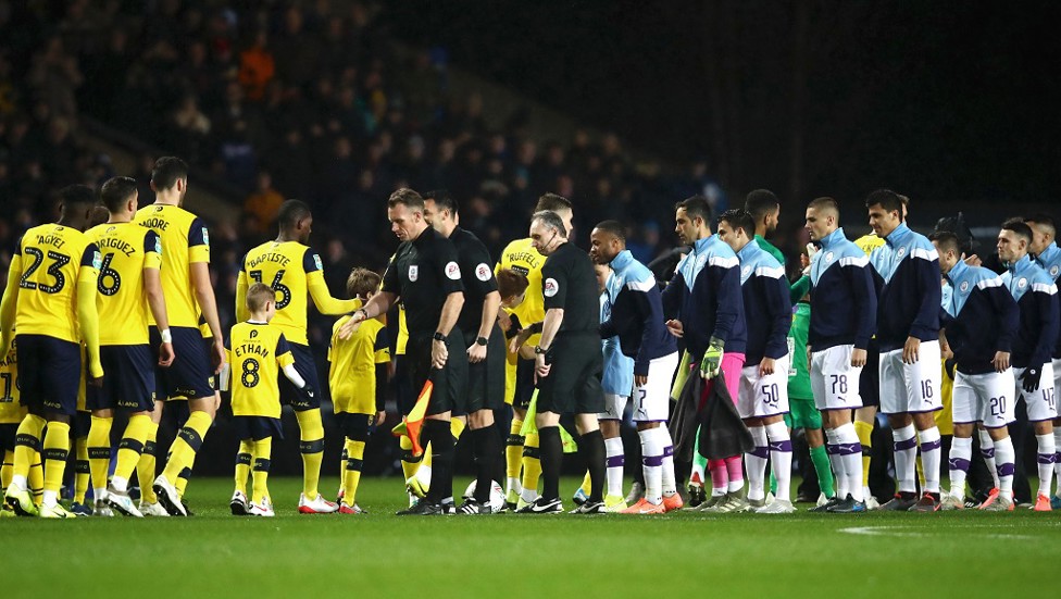 HANDSHAKES ALL-ROUND : Pre kick-off pleasantries