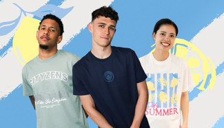 Three individuals wearing Manchester City-themed t-shirts posing in front of a blue and yellow graphic backdrop with lemons.
