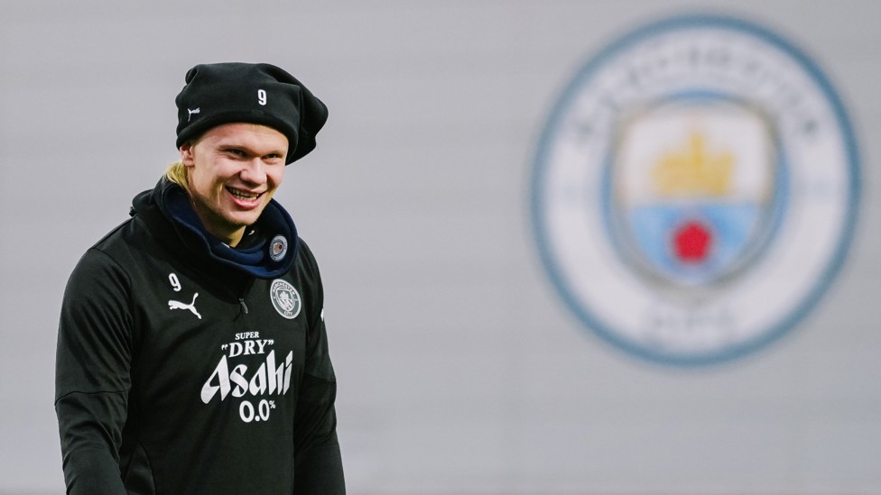 WRAPPED UP : Erling Haaland is better prepared for the chilly Manchester weather. 