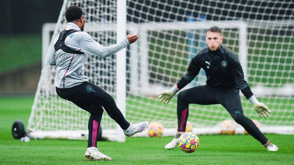 CAUSING A STER : Raheem Sterling tries his luck against Mikki van Sas