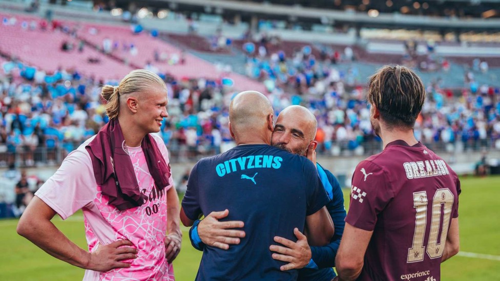 HELLO AGAIN : Enzo and Pep greet each other during the 2024/25 pre-season friendly match between City and Chelsea in Ohio, USA.