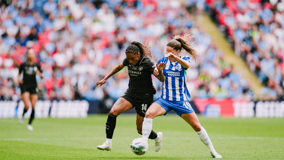 Probing : Kerolin attempting to unlock the Brighton defence