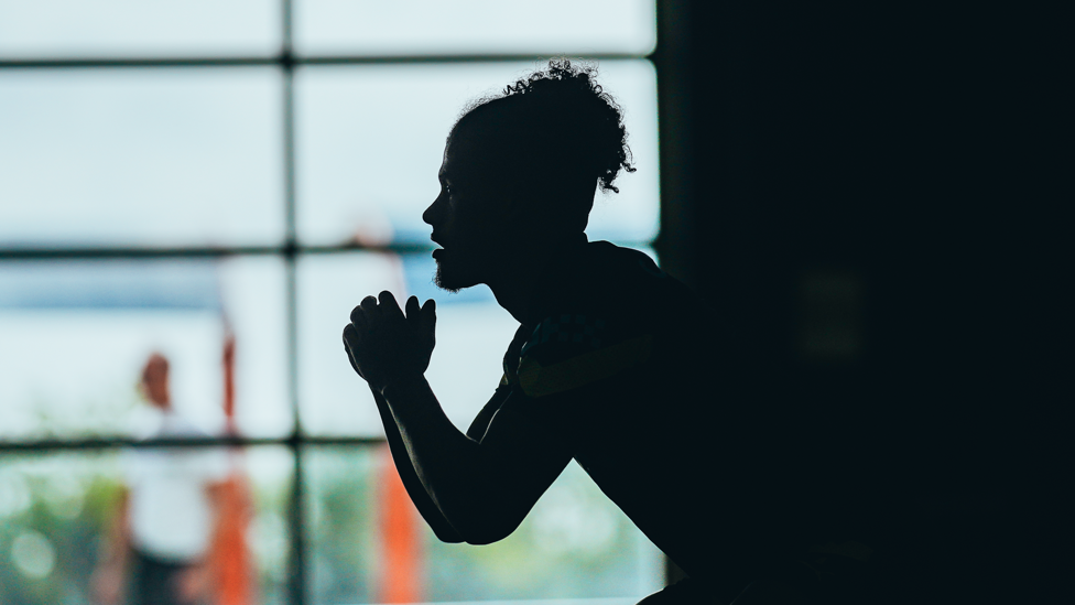 IN THE SHADOWS : Kalvin Phillips limbers up ahead of the session