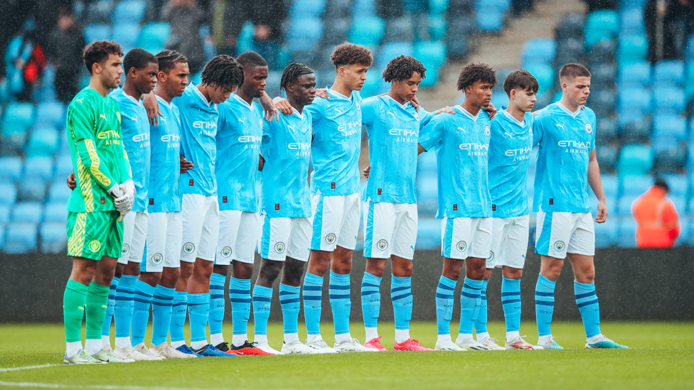 MOMENT TO PAUSE: The City squad honour the victims of the Morocco earthquake and Libyan floods