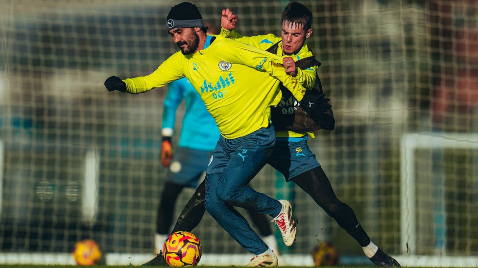 TOUGH BATTLE : Ilkay Gundogan put under pressure by Jacob Wright.