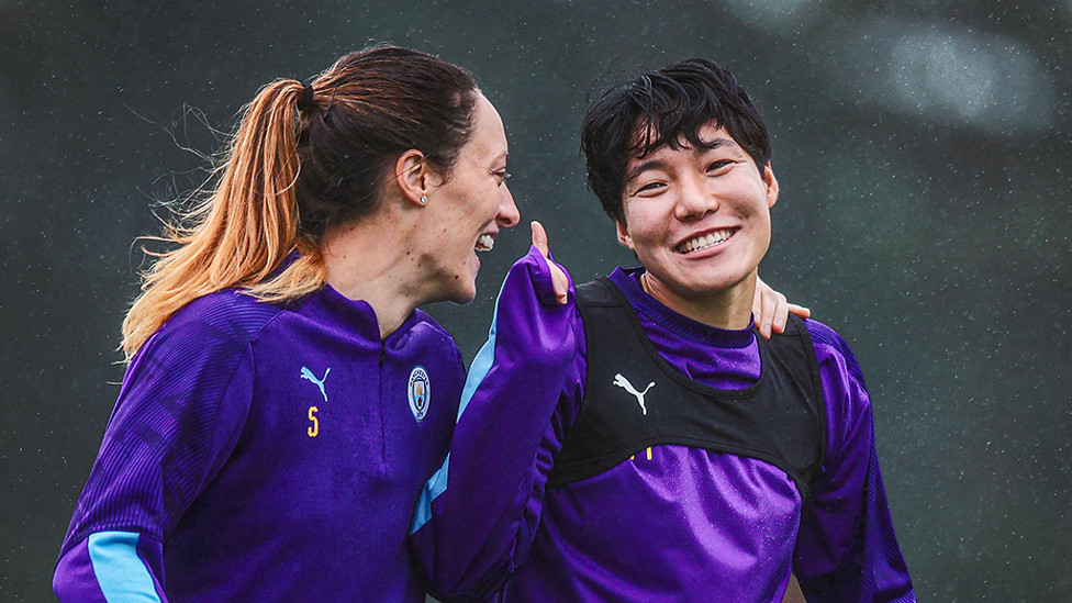 LAUGHTER IN THE RAIN : Megan Campbell and Lee Guem-min enjoy a joke