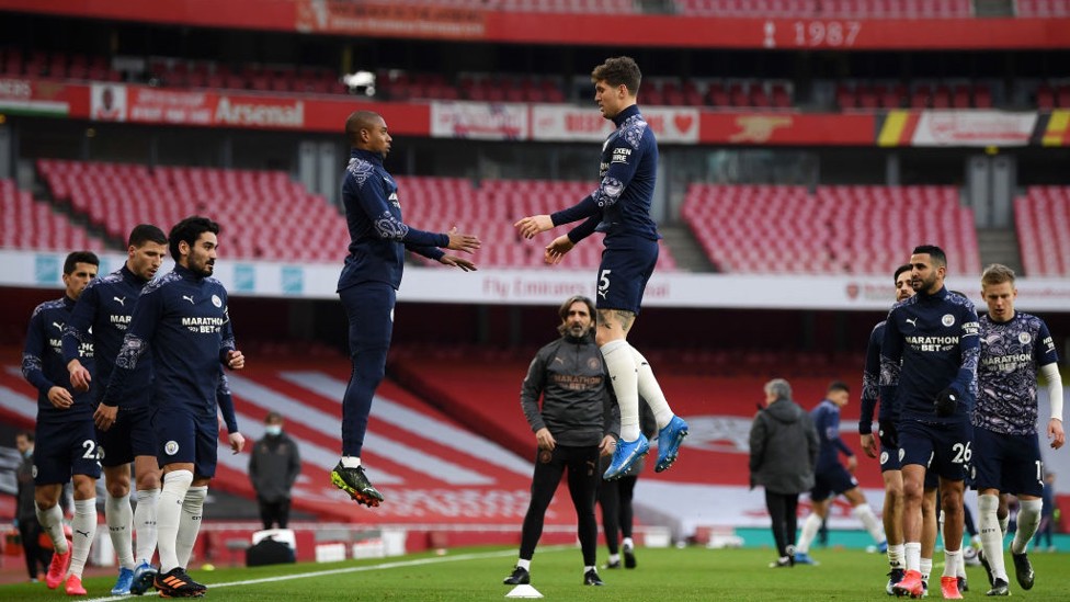 LEVITATING : Stones and Fernandinho hang in the air as the warm up winds down.