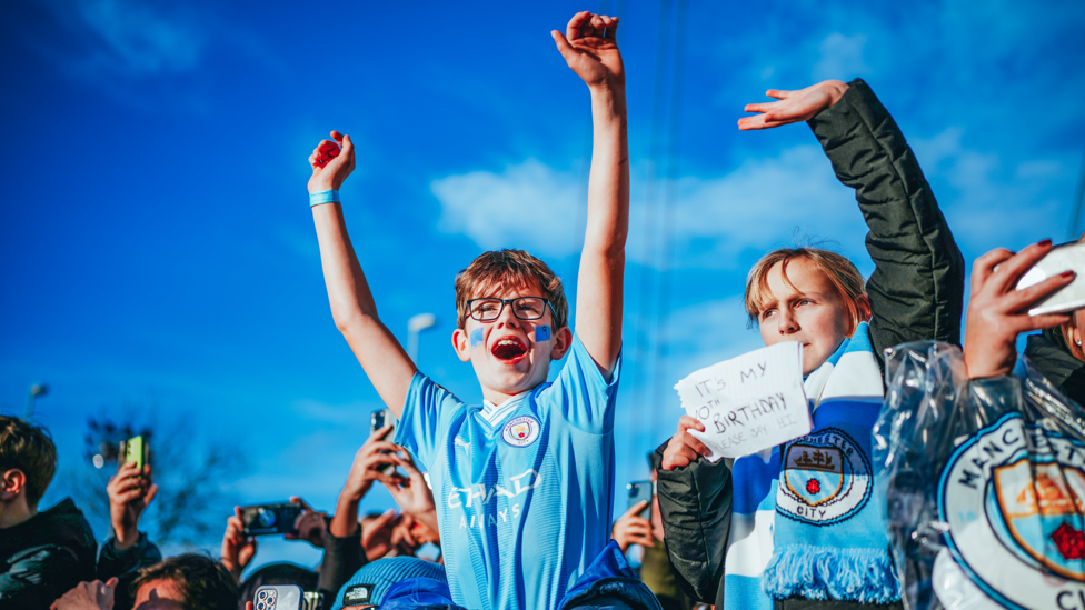 THE FANS: The supporters welcome City off the team bus in high spirits