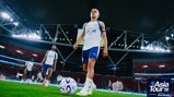 A Manchester City player wearing Puma gear on the field with a football during the Asia Tour '26, presented by Abu Dhabi.