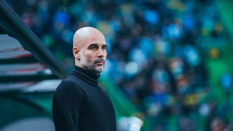 THE BOSS: Guardiola watches the warm up.