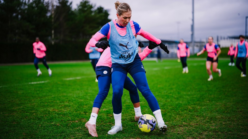 HEAVY PRESSURE : Rebecca Knaak holds off her marker