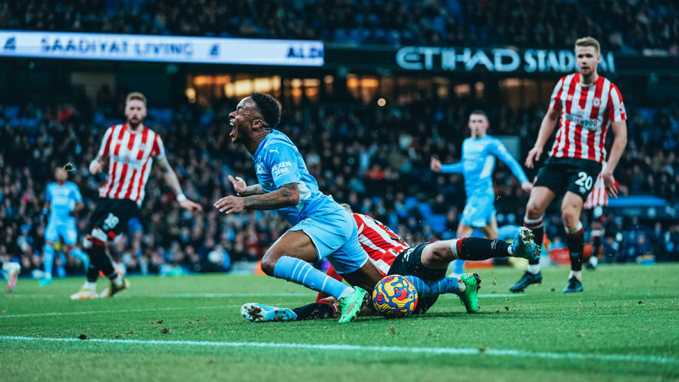 PENALTY : Sterling is brought down inside the area by Roerslev