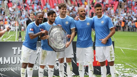 NEW ADDITION: City's stars pose for pictures with the newly-retained Community Shield.
