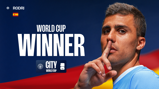 Image features a person posing with a finger to their lips. Text on the image reads 'World Cup Winner' with a Spanish flag and 'Rodri' text. Manchester City branding is present.