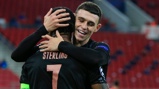 ALL SMILES: Foden embraces Sterling after the skipper's wonderful assist.