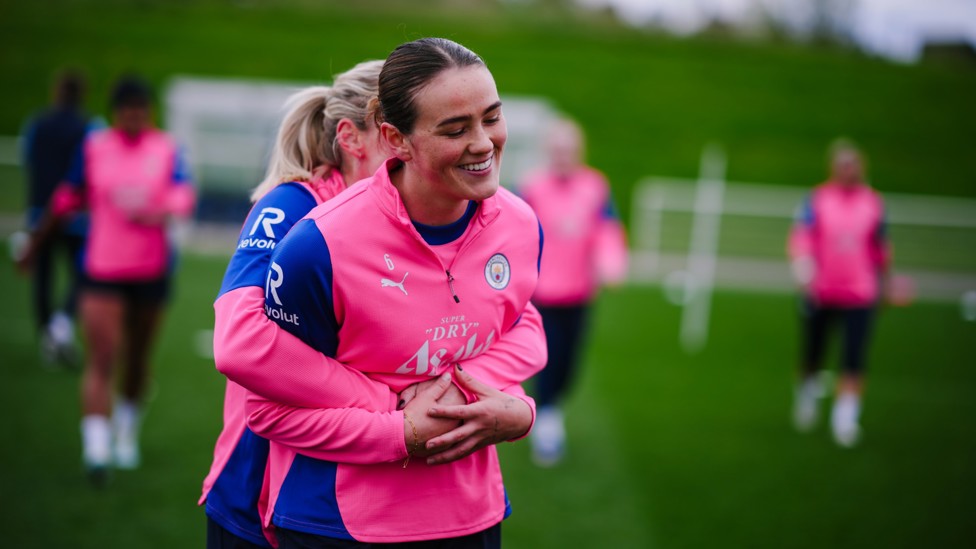 GUESS WHO : Are you able to figure out who is hugging Grace Clinton?