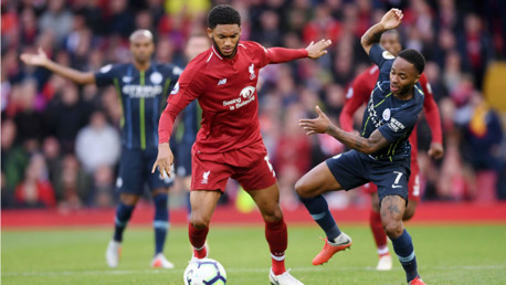 AT ARM'S LENGTH: Raheem Sterling looks to challenge Joe Gomez