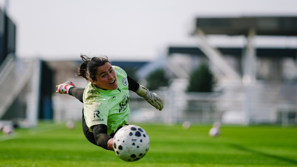 DIVING IN : Eartha Cumings lunging for a ball