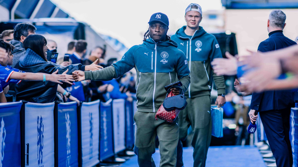 ARRIVAL : Doku and Haaland make their way into the stadium.