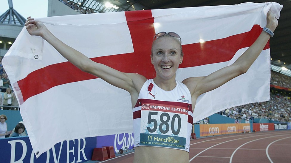 FLYING THE FLAG: Paula Radcliffe celebrates winning the women's 5000m