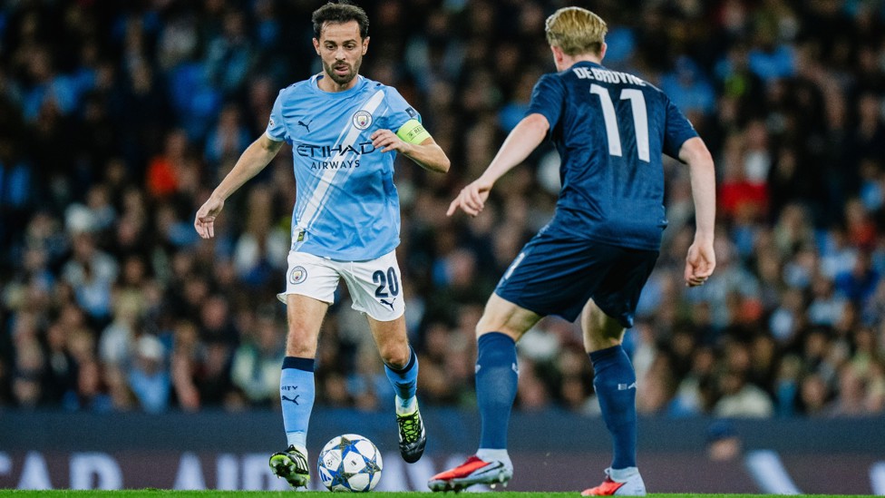 PAST AND PRESENT  : Bernardo looks to take on De Bruyne.