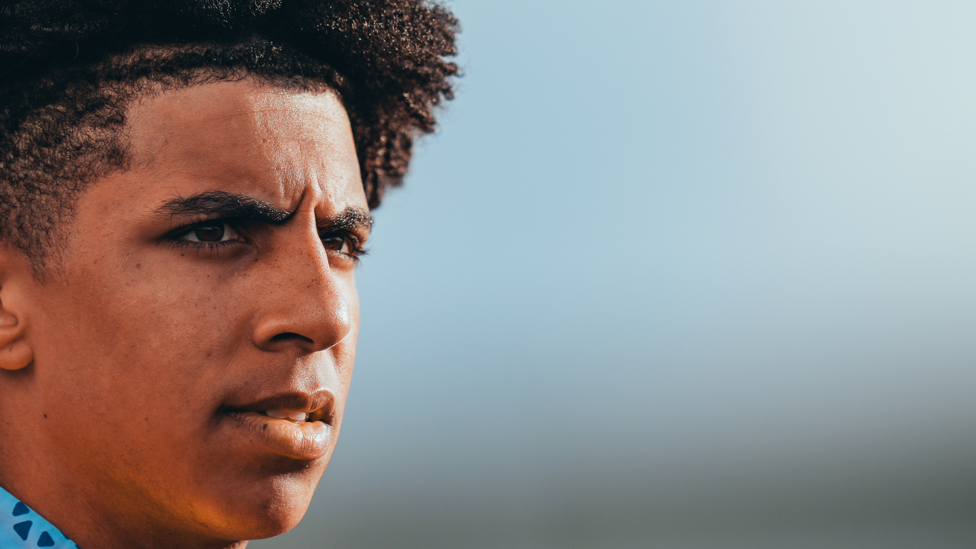 SOLID STARE : Rico Lewis gets his game face on before training