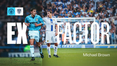 Image featuring two football players with blurred faces. One is in a Manchester City kit and the other in a Leeds United kit, with the text 'EX FACTOR' and 'Michael Brown'. Logos for Manchester City and Leeds United are shown.
