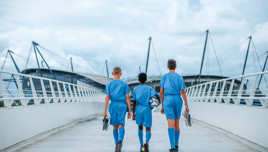 Three young players walking to the etihad