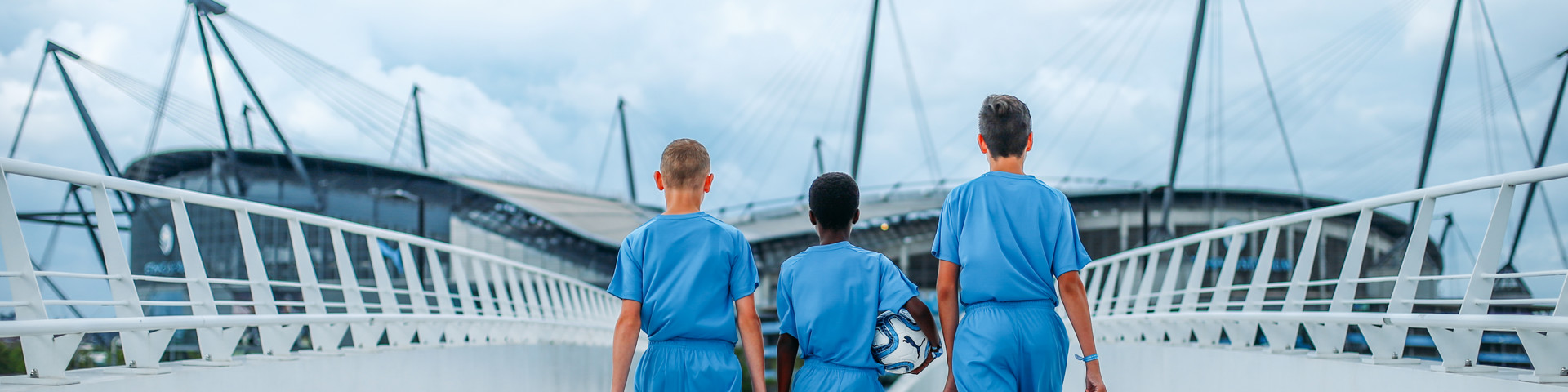 Three young players walking to the etihad