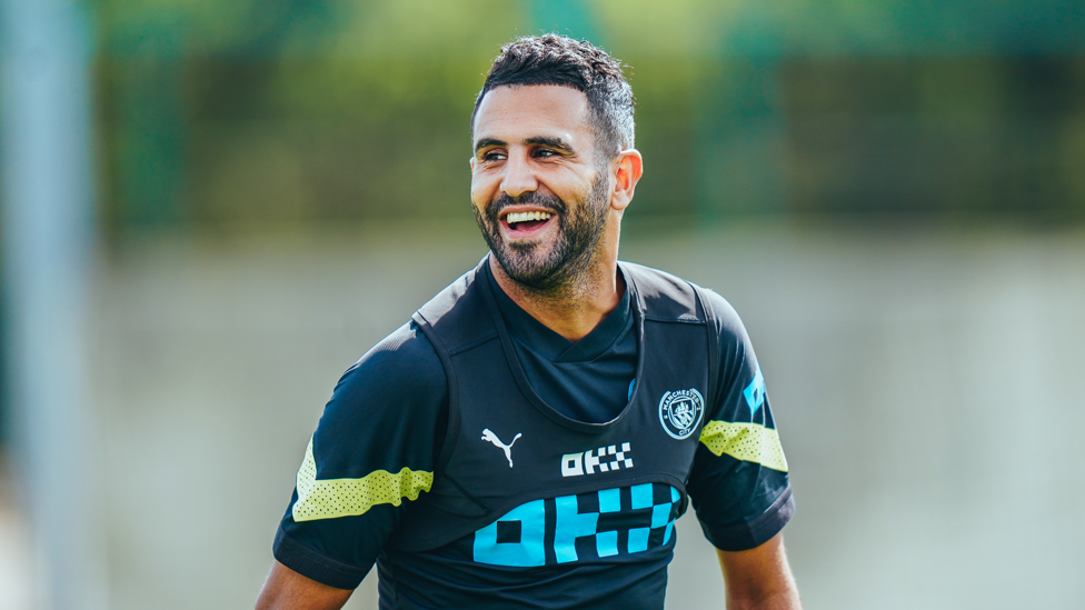GRINNING : Riyad Mahrez.