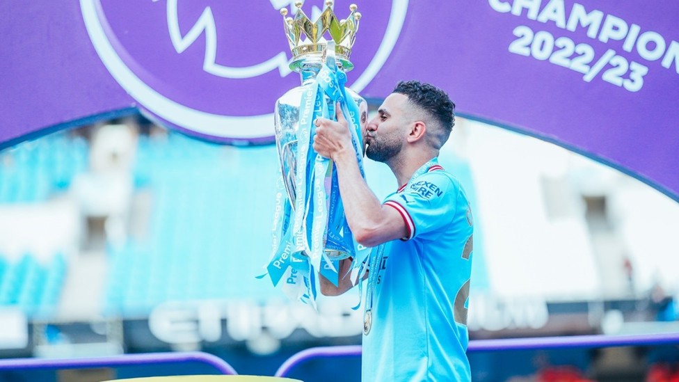 MAGIC MAN : Mahrez kisses the Premier League trophy after winning it for a third consecutive season in May 2023.